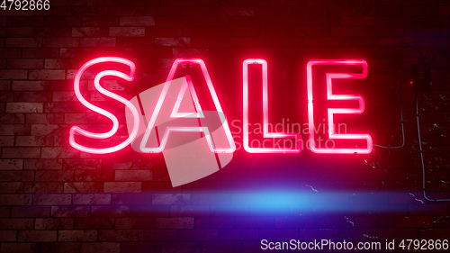 Image of neon light sale sign