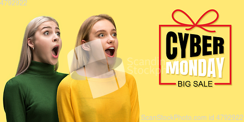 Image of Portrait of young caucasian women surprised and shocked of cyber monday