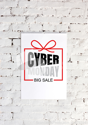 Image of Cyber monday ad on white brick background