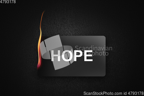 Image of burning credit card hope on black background