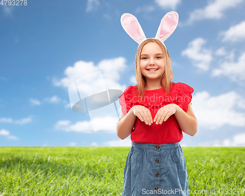 Image of happy girl wearing easter bunny ears headband