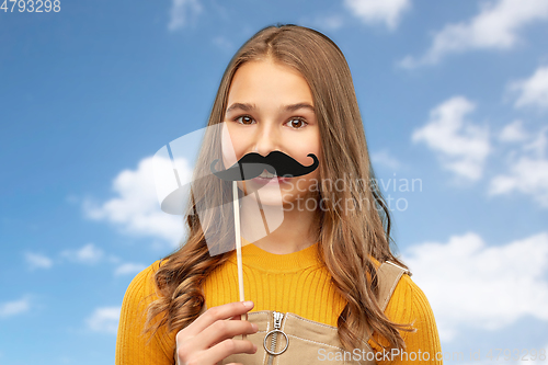 Image of teenage girl with black moustaches party accessory