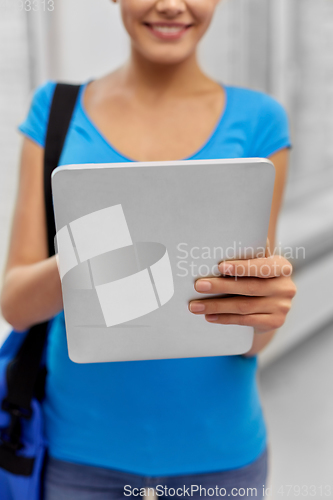 Image of student woman with bag and tablet computer