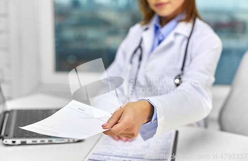 Image of close up of doctor with prescription at hospital