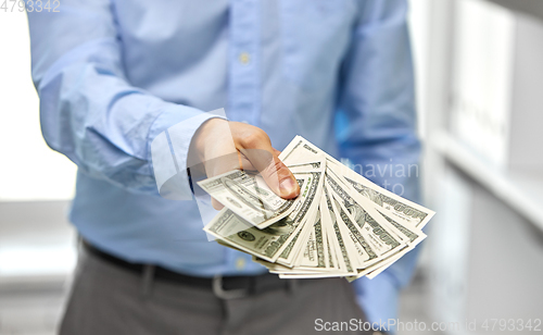 Image of close up of businessman with american dollar money