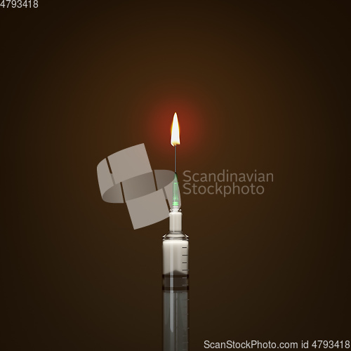 Image of syringe candle light