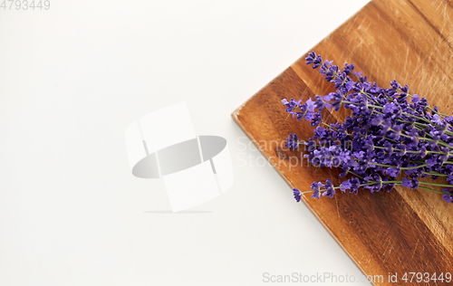 Image of bunch of lavender flowers on wooden board