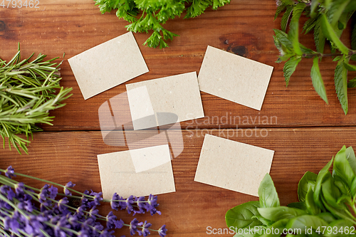 Image of greens, spices or medicinal herbs on wood