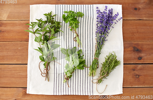 Image of greens, spices or medicinal herbs on towel