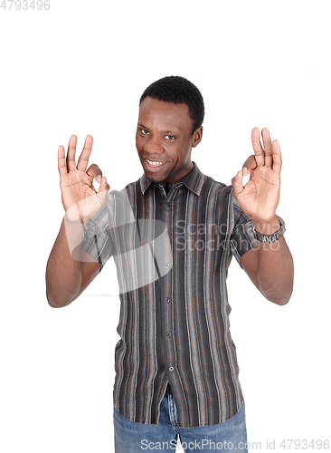 Image of Young African man making OK sign