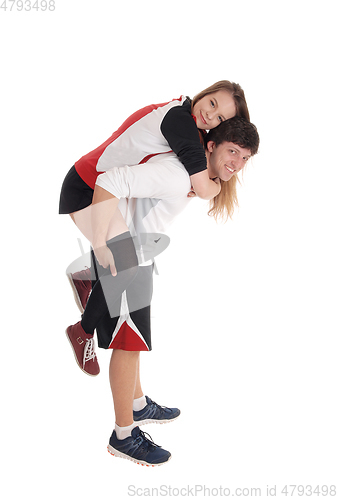 Image of Young couple in exercise outfit do piggyback