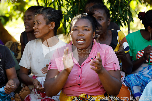 Image of Malagasy woman from village traditional singing and dancing