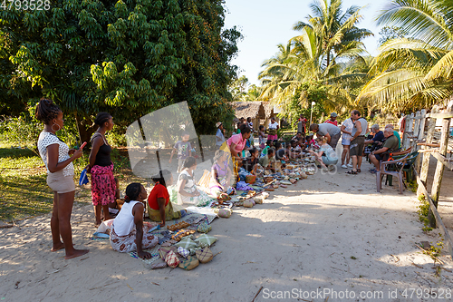 Image of Malagasy woman from village selling souvenir, Madagascar