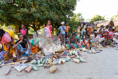 Image of Malagasy woman from village selling souvenir, Madagascar