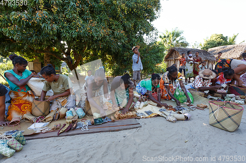 Image of Malagasy woman from village selling souvenir, Madagascar