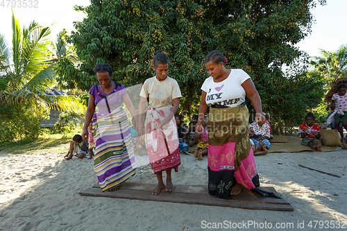 Image of Malagasy woman from village traditional singing and dancing