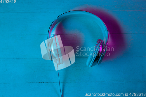 Image of Top view of set of gadgets in purple neon light