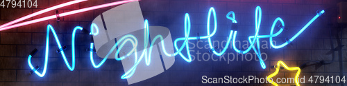 Image of neon light sign nightlife with star