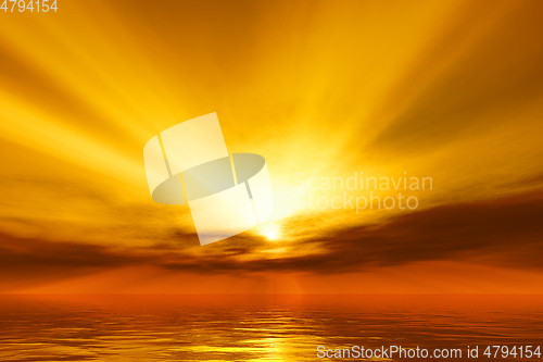 Image of warm sunset over the ocean with god rays