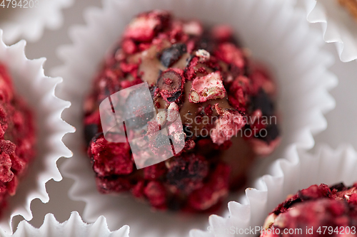 Image of close up of different candies in paper cups