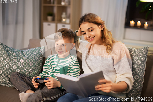 Image of happy mother with little son spending time at home