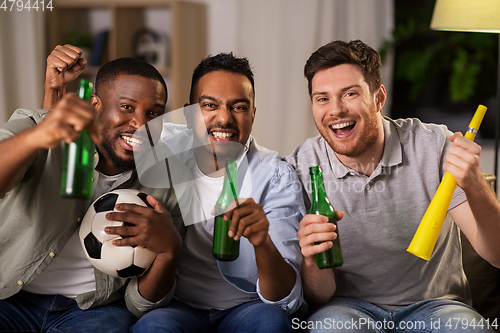 Image of friends or soccer fans with ball and beer at home