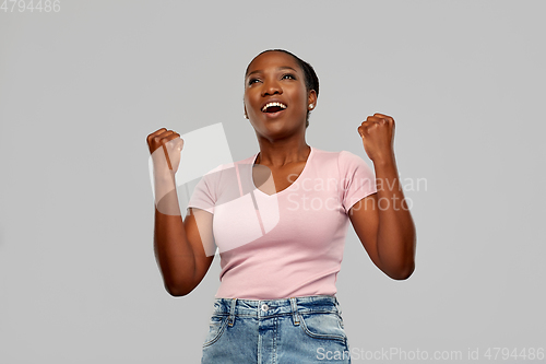 Image of happy african american woman celebrating success