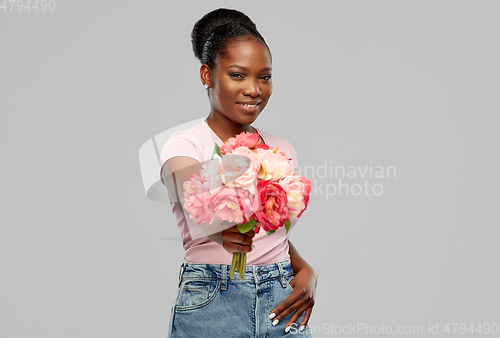 Image of happy african american woman with bunch of flowers