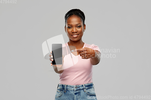 Image of happy african american woman using smartphone