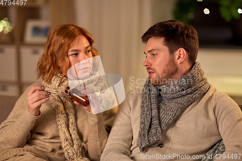 Image of sick couple with medicine or antipyretic syrup