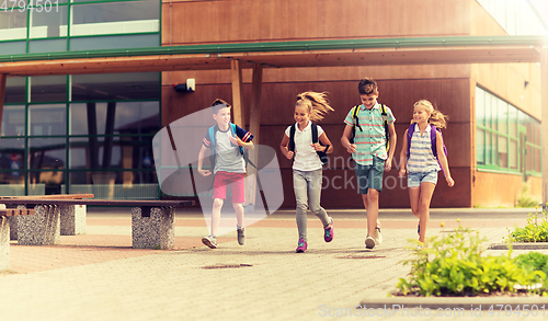 Image of group of happy elementary school students running