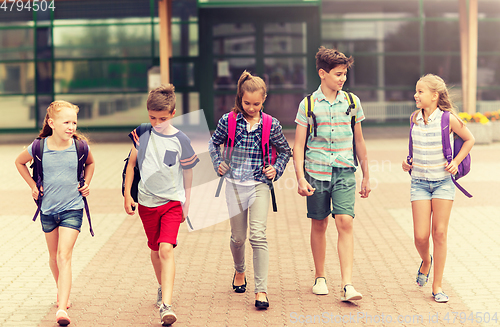 Image of group of happy elementary school students walking