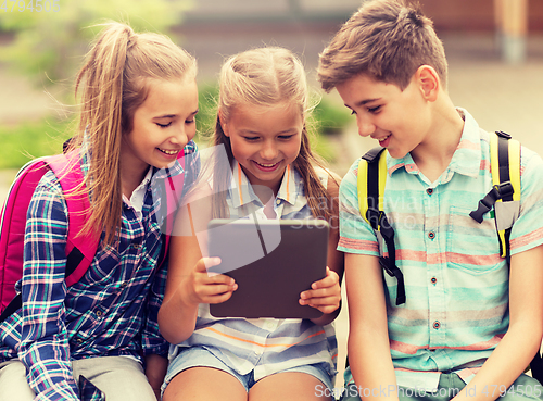 Image of group of happy elementary school students talking