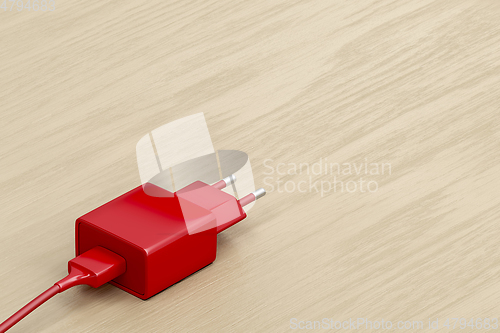 Image of Red smartphone charger