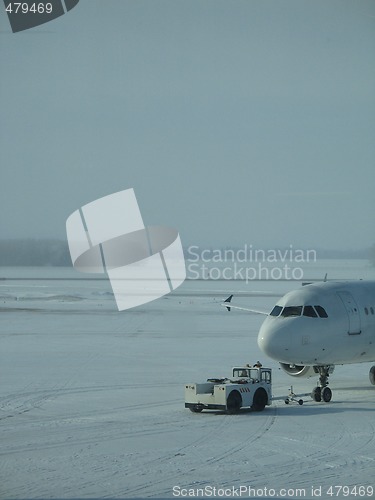 Image of towed airplane in the winter