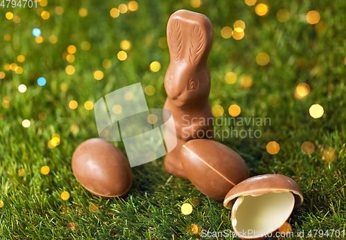 Image of chocolate bunny and easter eggs on grass