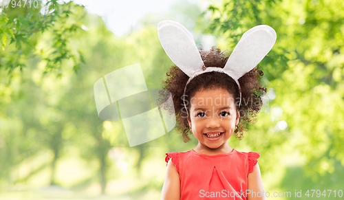 Image of happy little girl wearing easter bunny ears