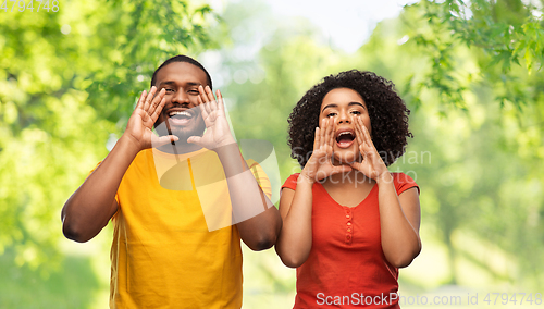 Image of happy african american couple calling