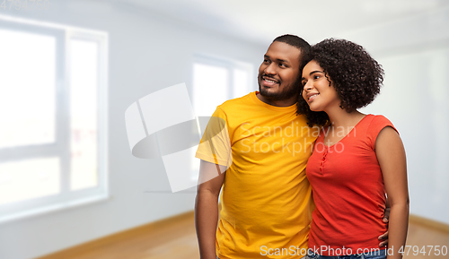 Image of happy african american couple hugging