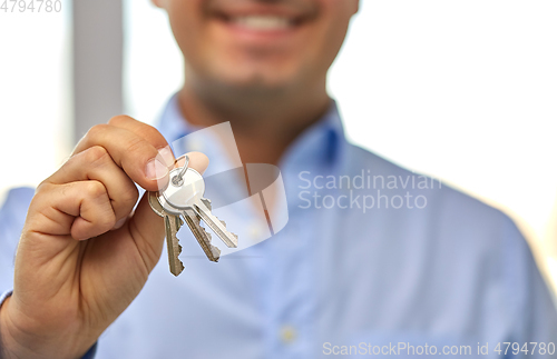 Image of close up of smiling man holding house keys