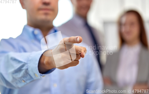 Image of close up of businessman pointing finger