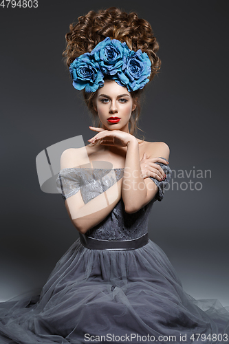 Image of girl with beautiful high curly hairstyle