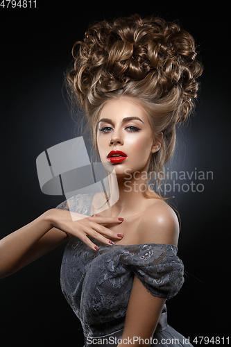 Image of girl with beautiful high curly hairstyle