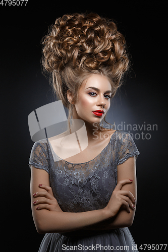 Image of girl with beautiful high curly hairstyle