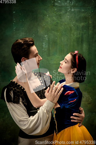 Image of Young ballet dancers as a Snow White\'s characters in forest