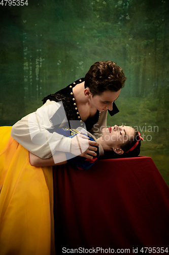 Image of Young ballet dancers as a Snow White\'s characters in forest