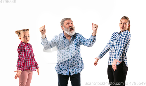 Image of Family members arguing with one another on white studio background.