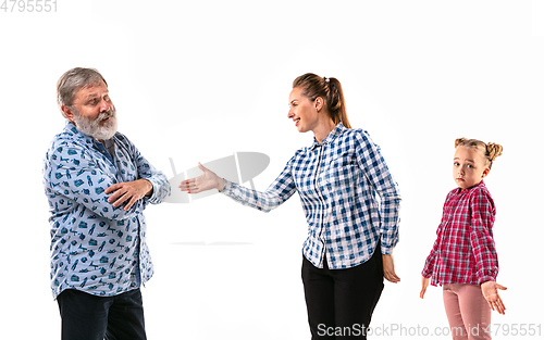 Image of Family members arguing with one another on white studio background.