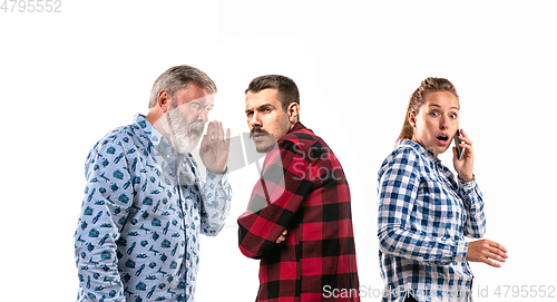 Image of Family members arguing with one another on white studio background.