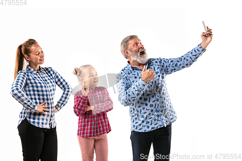 Image of Happy family with child looks happy together on white background